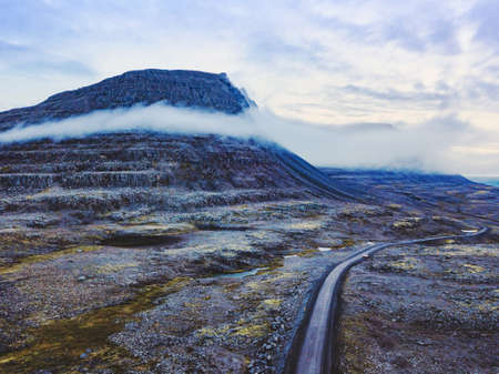 beautiful scenic road in mountain landscape, travel to fjords in Iceland, roadtripの写真素材