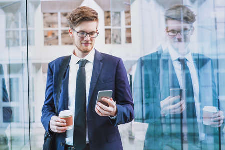 banking online, businessman using smartphone mobile app outsideの写真素材