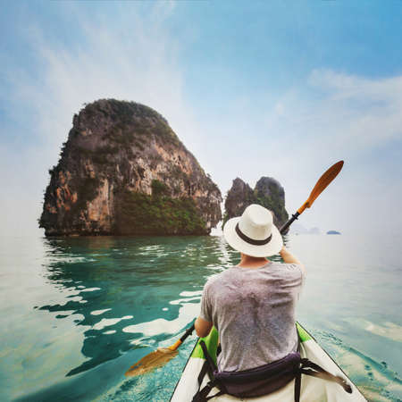 travel by kayak in Asia, beach holiday tourism activity, man tourist kayaking on tropical beachの写真素材