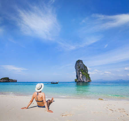 beach holidays, travel to Thailand, woman tourist  relaxing near turquoise sea, tourism destination abroadの写真素材