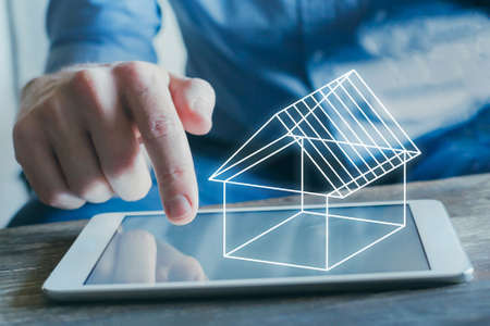 real estate digital project, 3d concept model of virtual house on the screen of tablet computerの写真素材