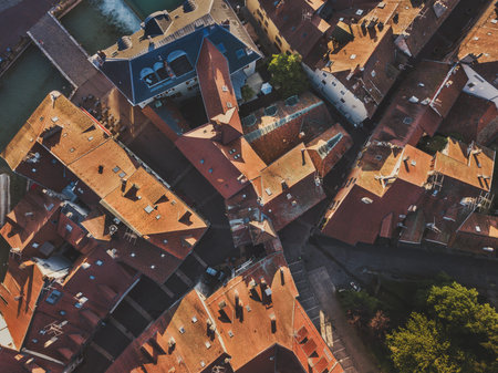 Annecy old town, France, aerial top down view of tile roofs of historical buildings in Europe