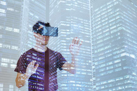 virtual reality, man wearing VR glasses double exposure, digital worldの写真素材