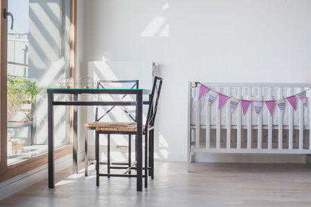 baby bed in white living room or bedroom interior, modern scandinavian design style