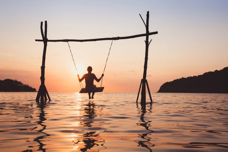 beach vacation on the sea at sunset, holidays on paradise tropical island, silhouette of woman on...