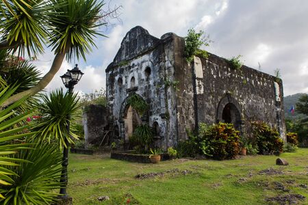 view from Santa Isabel Fort in Taytay with tree and ancient church on the foregroundの写真素材