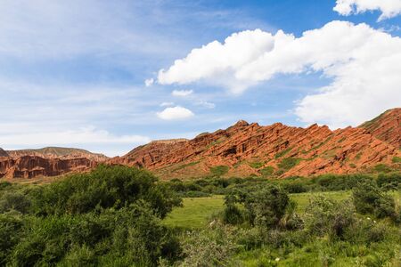 Seven bulls Jeti Ogyz valley red sandstone formation in Kyrgyzstanの写真素材