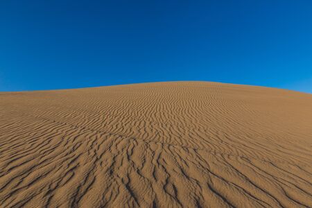 evening wind patterns in sand desert Bafgh in Yazd, Iranの写真素材
