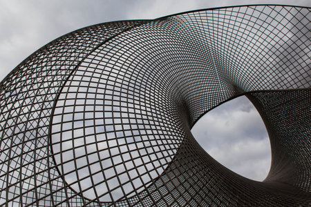 KAZAKHSTAN, NUR-SULTAN - AUGUST 11, 2017: Astana Expo statue of mebius strip with cloudy sky on...