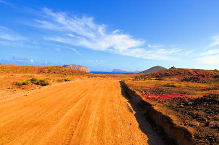 North-Western edge of Island Graciosa with an ancient volcano on the right and Island Montana Clara across the water. の写真素材