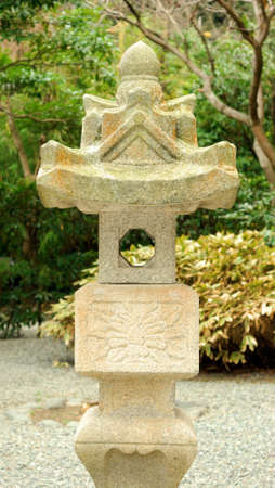 Stone lantern in Japanese garden surrounding Greait Buddha statue in Kamakura, Japanの写真素材