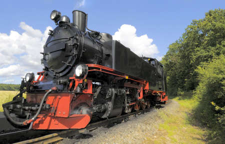 Steam train running on island Rugen, Northern Germanyの写真素材