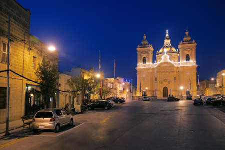 Evening view of Xagra town square with Church of Our Lady of Victoryの写真素材