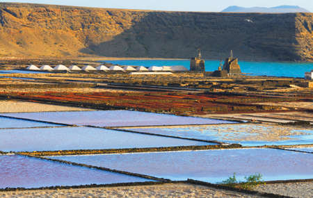 Salt fields, known as "Las Salinas de Janubio", situated in the South-West of the island, near the village of Yaiza at the coastal road towards Playa Blanca. の写真素材