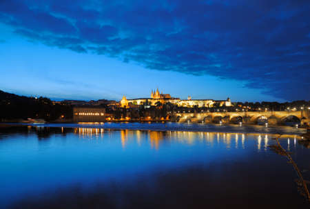 Evening view of Prague Castle and Charles Bridge over Vltava river from Novotneho Lavka, Prague, Czechの写真素材