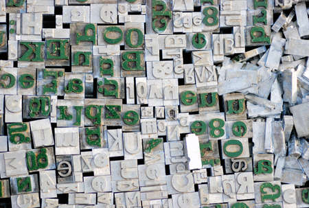 Old letterpress German letters from a flea market, grey and green onesの写真素材