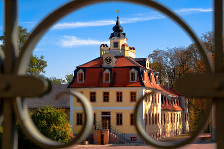 Baroque Belvedere Castle in Weimar. Pavilion flanking the main building captured via ornate railing.のeditorial素材