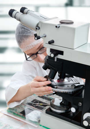 Microscopist tunes biopsy sample to look for tumor formation in patient tissueの写真素材