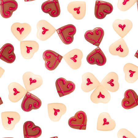 Chocolate hearts on white seamless background の写真素材