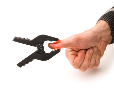 Hand with a clamp on thumbの写真素材