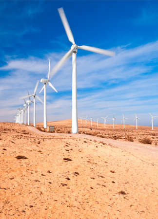 Windmills in the desert; Fuerteventura, Canary islands, Spain; long exposure to show rotationの写真素材