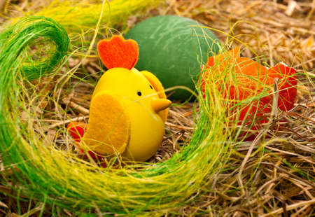 Easter eggs, eggshell and hatched chicken on hay backgroundの写真素材