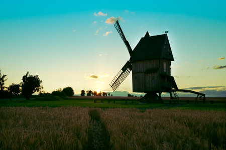 vimntage windmill silhouette towards sunset