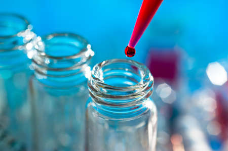 Sample loading into plastic vials, closeupの写真素材