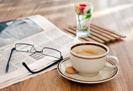 Coffee and financial newspaper in the morningの写真素材
