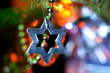 Closeup on a silver star on Xmas tree の写真素材
