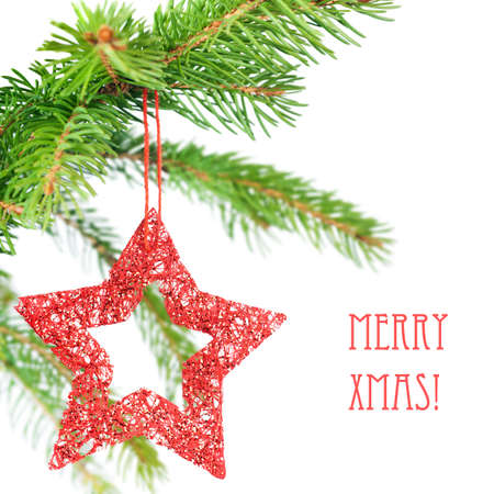 Closeup on red star on a Christmas tree, isolated on whiteの写真素材