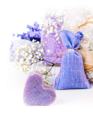 Closeup on handmade lavender soap with aromatic herbs and salts in the backgroundの写真素材