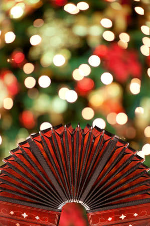 Open bandoneon with Xmas lights in a background, copyspaceの写真素材