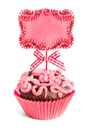 Decorated chocolate cupcake with empty plate on topの写真素材