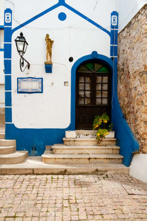 Front entrance of small chapel in Albufeira, West Portugalの写真素材