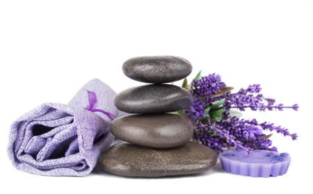Zen stack of stones, lavender soap, lavender and a towel on white backgroundの写真素材