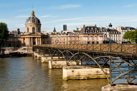 Paris, Pont des Arts in the bright Summer morningの写真素材