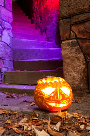 Jack O'Lantern guarding illuminated staircaseの写真素材
