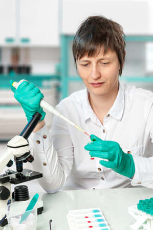 Scientist works in biological or medical laboratory の写真素材