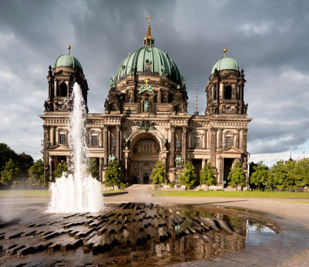 Berlin Cathedral, or Berliner Dom, with a fountain in frontの写真素材