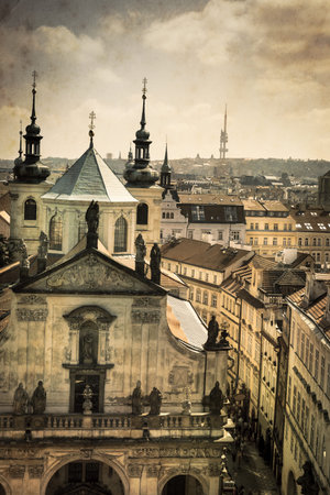 View from Old Town Bridge Tower in Prague on Kostel of St  Salvator, aged photo on old paper textureの写真素材