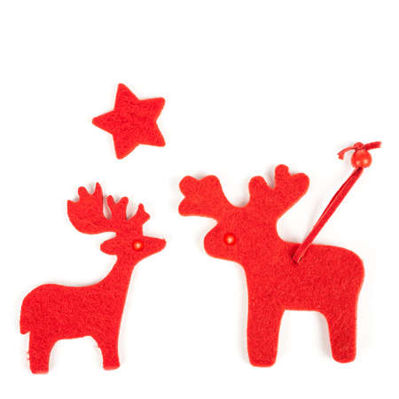 Red Christmas raindeers on white backgroundの写真素材