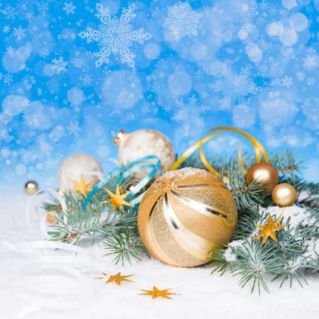 Golden Christmas decorations on abstract winter background, spaceの写真素材