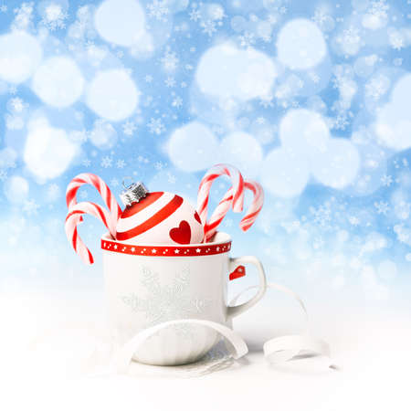 Red and white Christmas decorations on abstract winter backgroundの写真素材