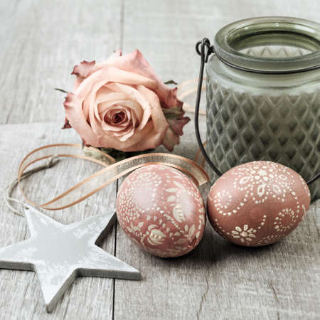 Easter decorations with easter eggs on wooden surfaceの写真素材