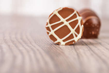 Closeup on chocolate truffles on a wooden surfaceの写真素材