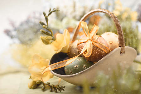 Easter with eggs and spring flowers, shallow DOF, text space の写真素材