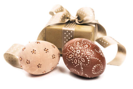 Easter egg and a gift box on white backgroundの写真素材
