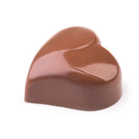 Chocolate heart truffle on white の写真素材