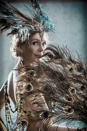 Portrait of exotic dancer wearing performance costume, tinted image, retro lookの写真素材